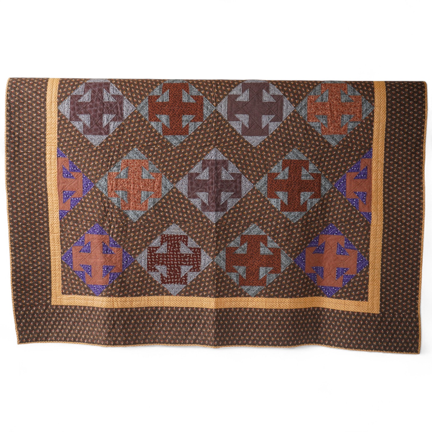 An American Virginian quilt, 1860-1870 (circa American Civil War). Known as a ‘T’ block Virginian style pattern, with a hand pieced and hand quilted front trunk, sold as an unused or washed quilt, designed in brown, red,